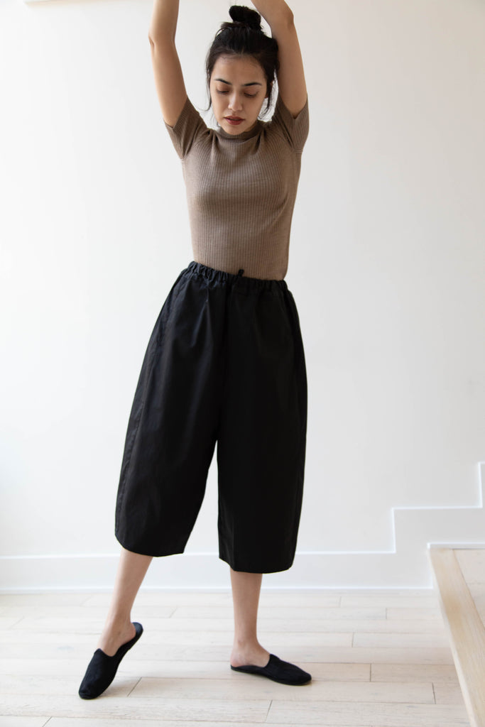 Gram | Black Coated Cotton Trousers