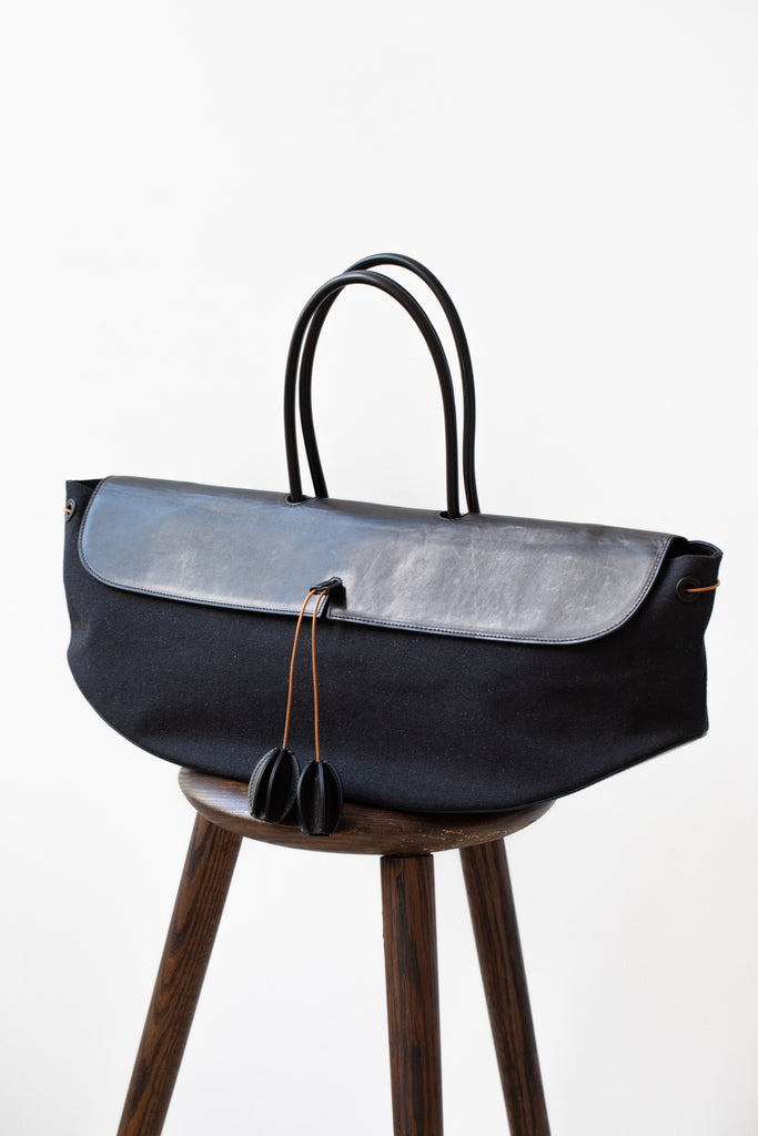The Backward Vendor | Rocking Hand Carry Bag in Black