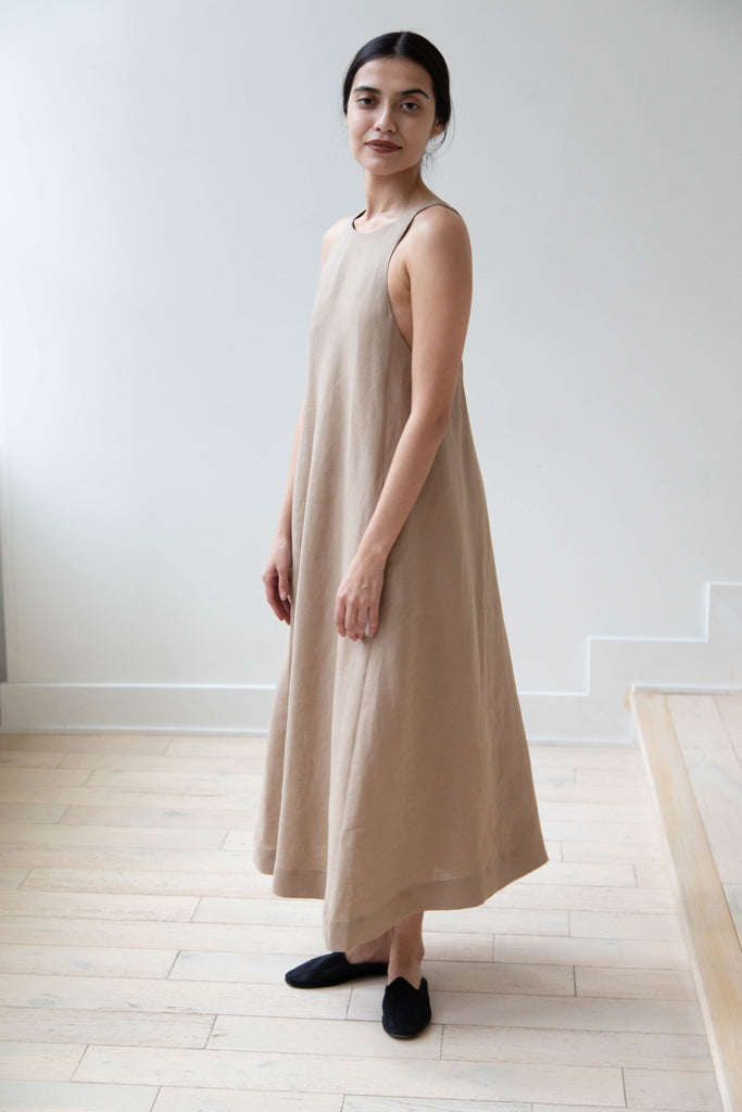 The Loom Linen Cross Back Apron Dress in Beige